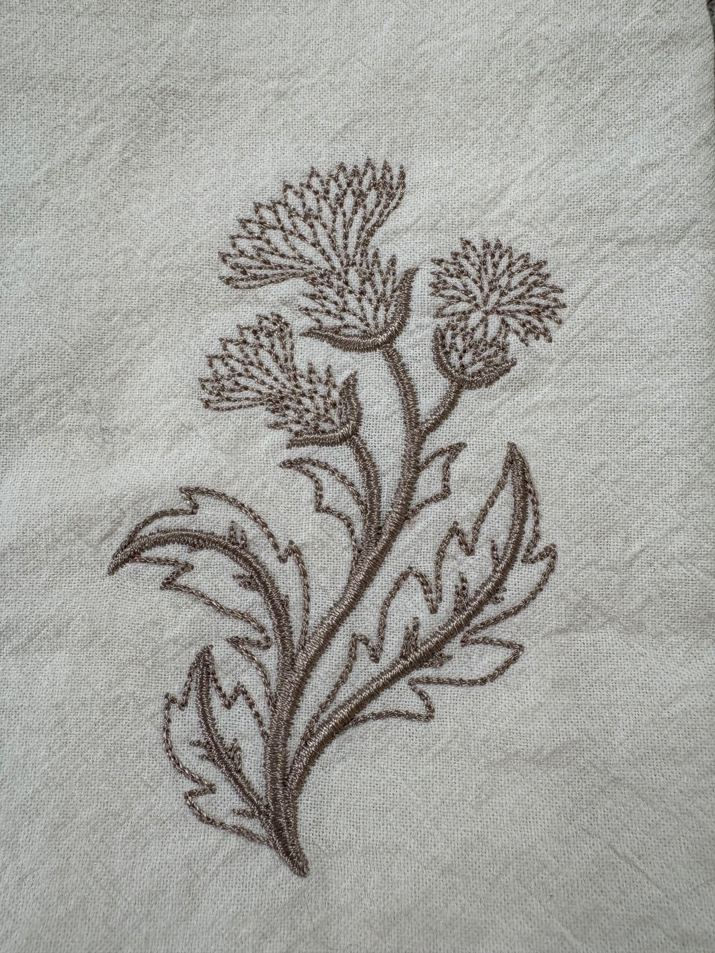 Delicate stems embroidered on natural flour sack napkins