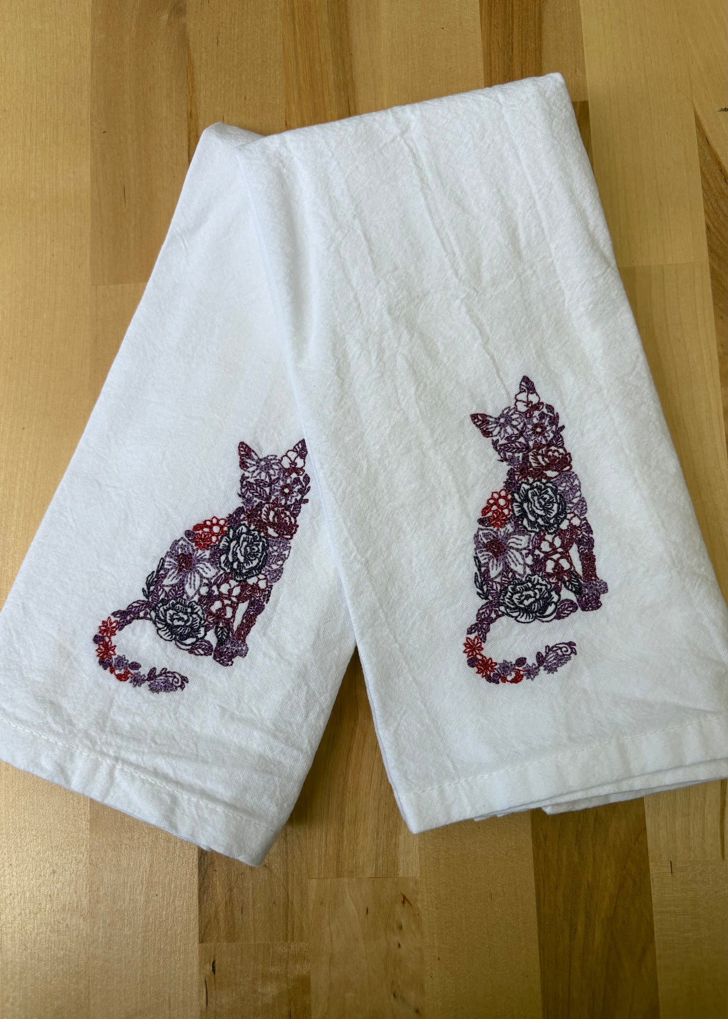 Bring a splash of fun to your dining with this delightful floral cat dinner napkin. Set against a crisp white background, it’s not only beautiful but also machine washable and reusable, making it perfect for everyday use or special occasions. Add a playful touch to your table that’s as practical as it is charming!