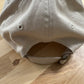Cat knocking over plant embroidered on ran dad hat