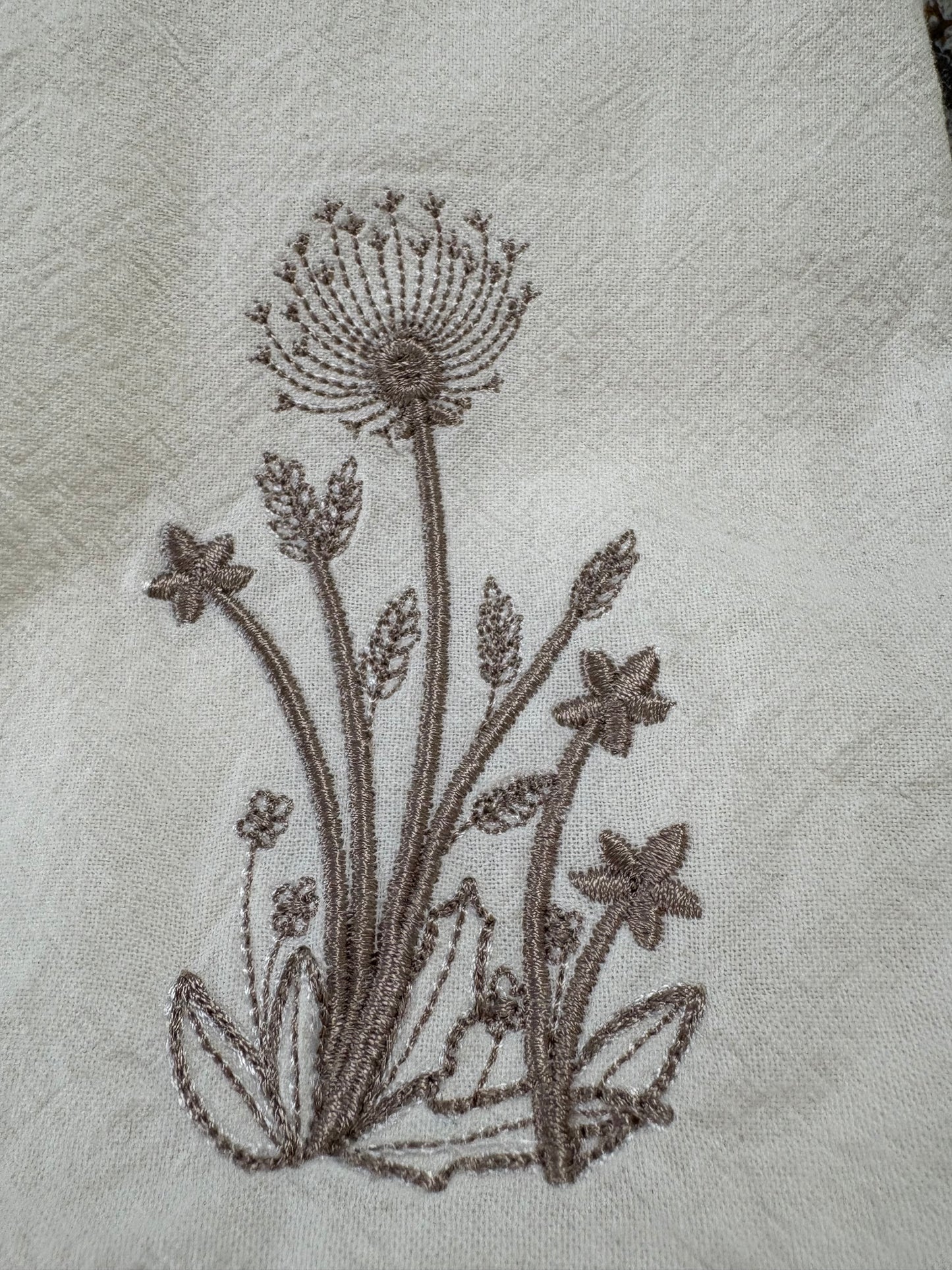 Delicate stems embroidered on natural flour sack napkins