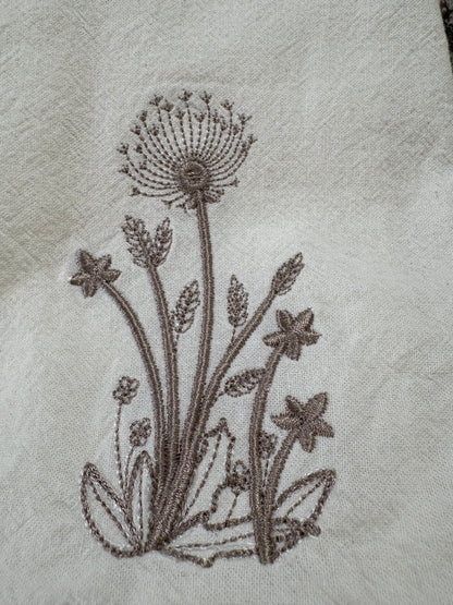 Delicate stems embroidered on natural flour sack napkins