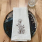 Delicate stems embroidered on natural flour sack napkins
