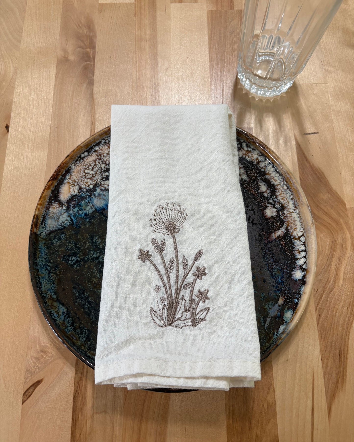 Delicate stems embroidered on natural flour sack napkins