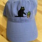 Cat knocking over plant embroidered on light purple cotton dad hat