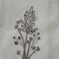 Delicate stems embroidered on natural flour sack napkins