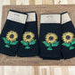 Sunflower embroidered on black dinner napkin