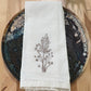 Delicate stems embroidered on natural flour sack napkins