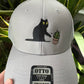 Cat knocking over plant embroidered on light grey Otto trucker hat