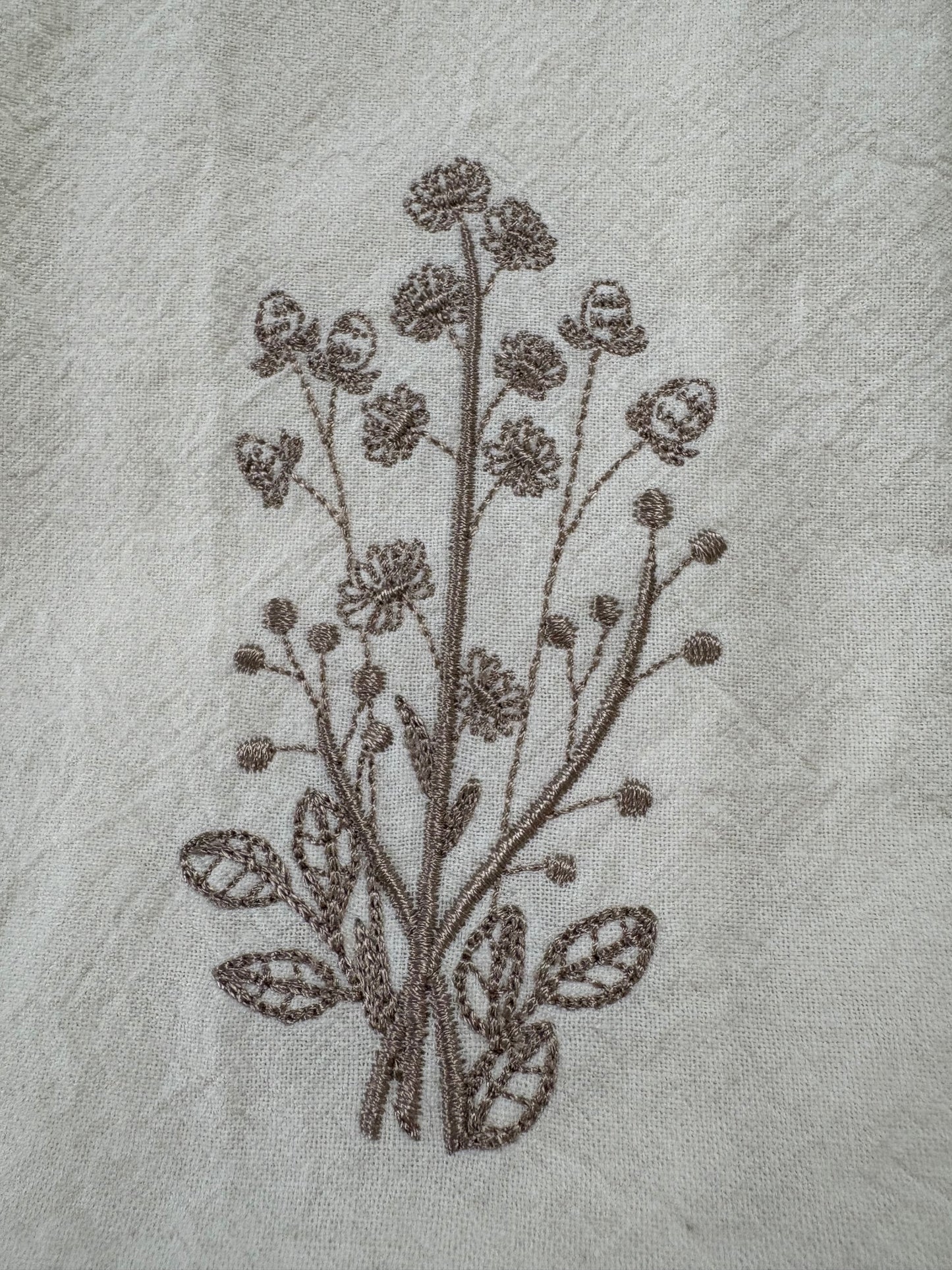 Delicate stems embroidered on natural flour sack napkins