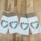 Wildflower heart embroidered on white dinner napkin
