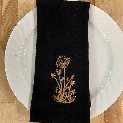 Delicate Botanicals embroidered on black dinner napkin