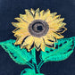 Sunflower embroidered on black dinner napkin