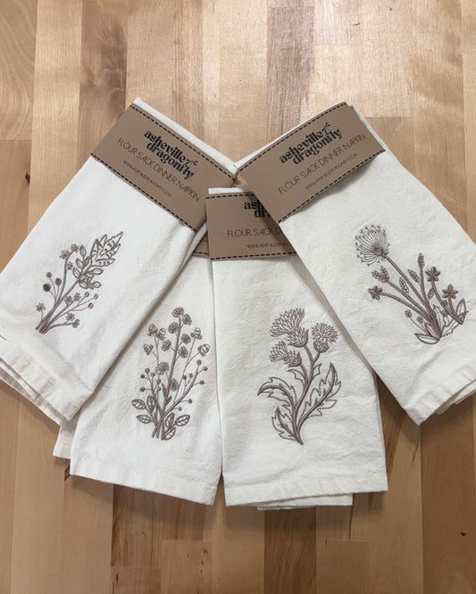 Delicate stems embroidered on natural flour sack napkins