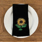 Sunflower embroidered on black dinner napkin