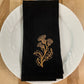 Delicate Botanicals embroidered on black dinner napkin