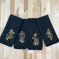 Delicate Botanicals embroidered on black dinner napkin