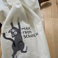 White towel with a black cat illustration and text 'Made from Scratch' on a wooden surface.