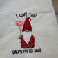 Embroidered towel with a gnome design and text on a white background
