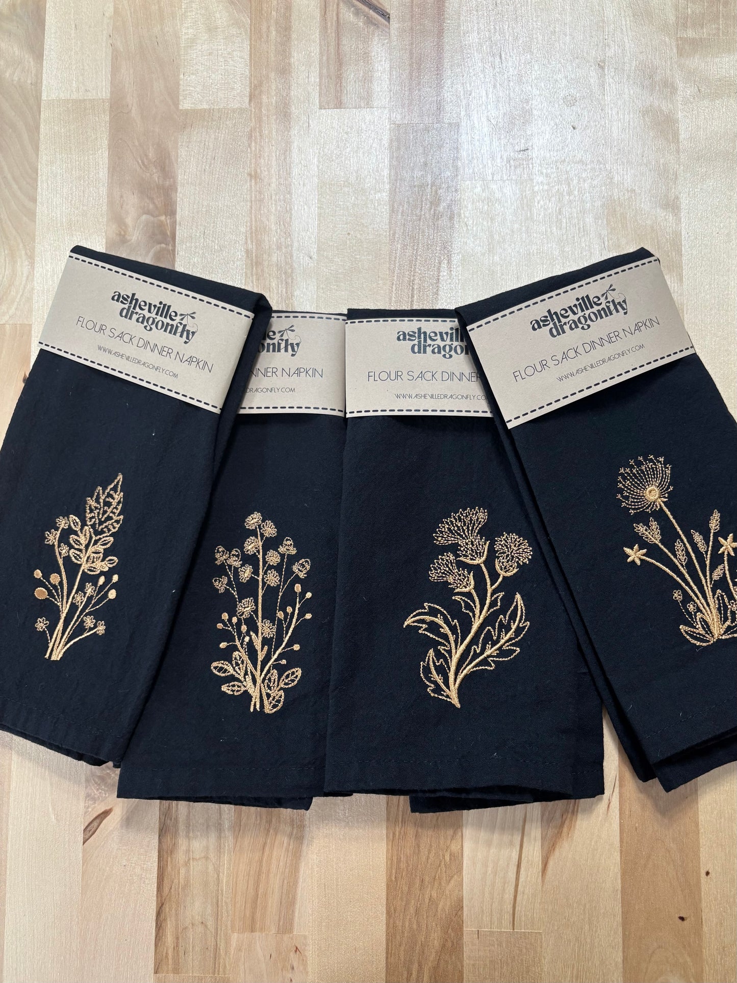 Set of black napkins with gold embroidered botanical stems 