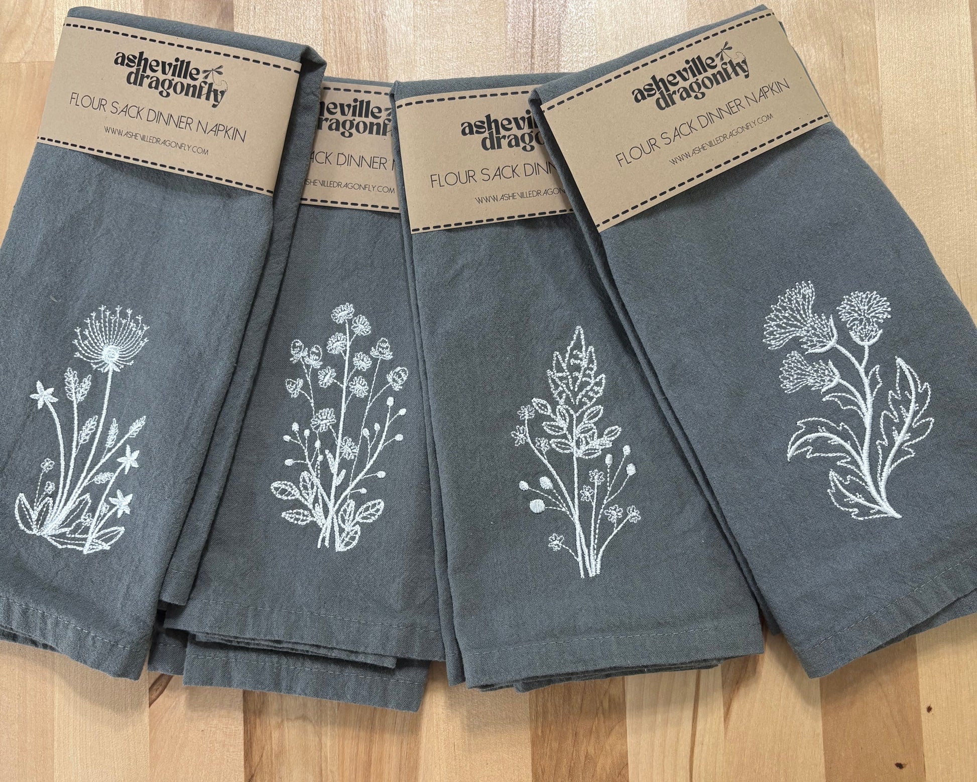 Set of grey napkins embroidered with delicate white stems
